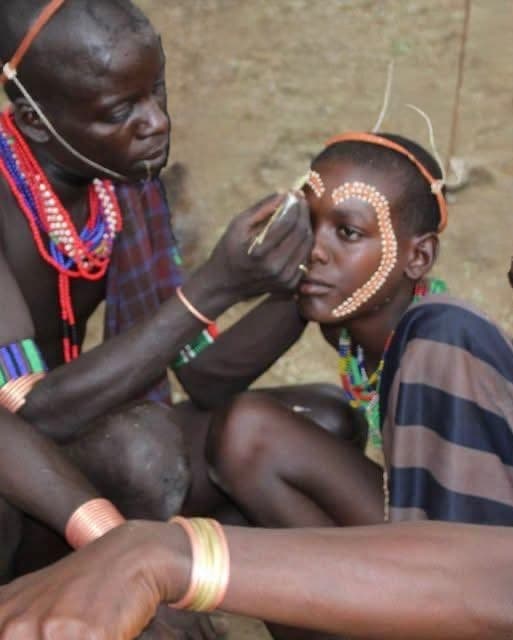 Child with traditional face paint in the Omo Valley, Ethiopia