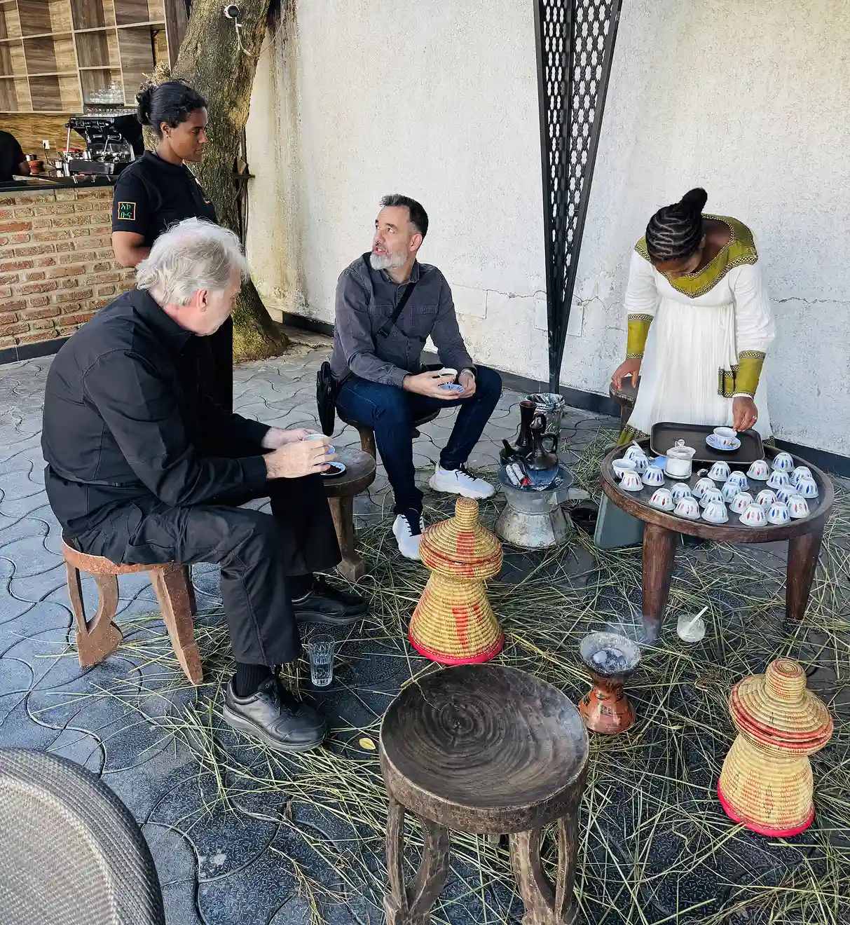 Travelers enjoying a traditional Ethiopian coffee ceremony with Lalibela Expeditions